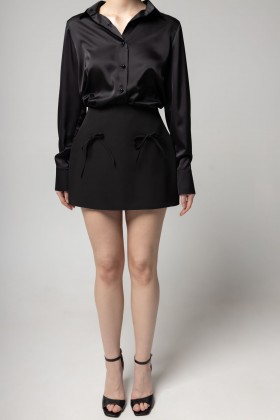 Шорти-спідниця чорного кольору з бантиками [130-0225]